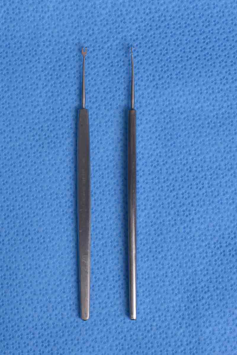 This small, doublepronged hook is used for holding and retracting the